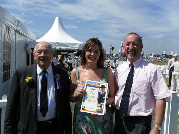 Katy Waller receives her travel scholarship from John Platt (left) and Meredydd David at the Cheshire Show